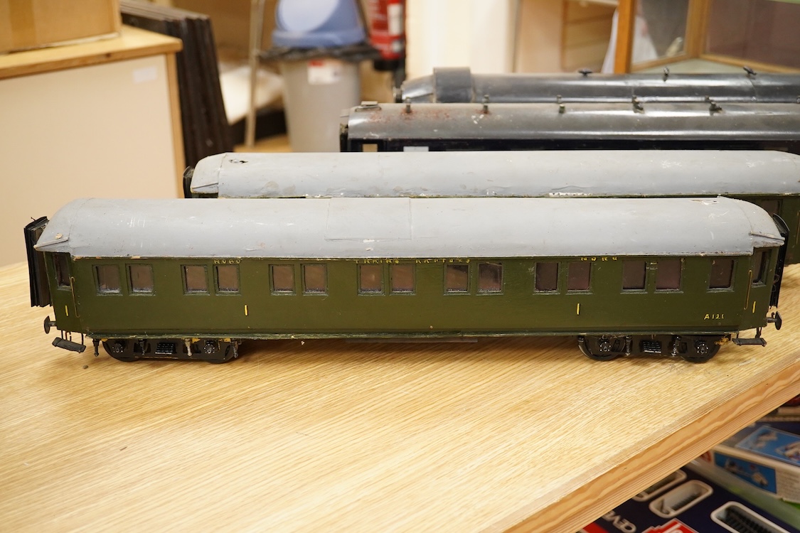 Four Gauge One Continental bogie coaches; two in very dark Green livery, and two ‘Trains Rapides Nord’ in dark green, including some scratch building and possible adaptation from kits